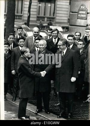 Jan. 23, 1973 - Mr. Kissinger and Le Duc Tho recommenced their secret meetings on Vietnam this morning in the International Conference Room on Kleber Avenue. Pictured: Mr. Xuan Thuy, Chief of the North Vietnamese Delegation at Paris's Conference, shakes the hand of Mr. Henry Kissinger. In the center, Mr. Le Duc Tho, exiting their meeting. Stock Photo