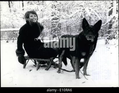 Dec. 12, 1973 - Going lovely young lady pictured here has just taken the time out - between the making of two single records - for a short sleigh - ride in Munich's vicinity near lake Hinterbruhl. It is attractive British singer Ireen Sheer who has becomed rather popular in Germany's hit parades lately. Just for kicks she is testing how good a sleigh-dog is Blacky, the German shepherd's dog. Obviously he has no trouble whatsever pulling the port and light-weighted Ireen Stock Photo