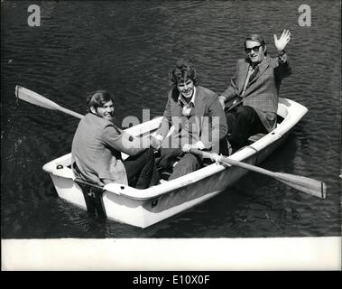 May 05, 1974 - Three men in a boat.: The new Gregory Peck film ''The Dove'' based on the true round-the-world voyage of Robin Lee Graham, will have a Royal World Premiere before Princess Anne and Captain Mark Phillips in London on Wednesday, 22nd May. Photo shows pictured in a boat in a yachting marina at Tower Bridge yesterday were Robin Lee Graham on whose round-the-world voyage the film is based; on left); Joseph Bottoms, who plays Robin's part in the film ''The Dove'', and Gregory Peck (right) Stock Photo