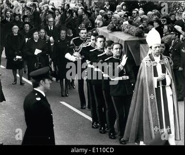 Feb. 02, 1975 - Funeral of Duke of Norfolk. The funeral of the Duke of Norfolk, who died last Thursday, was held today. A requiem mass was held at Arundel Roman Catholic Cathedral, at which the Queen was represented by Princess Alexandra. Prince Charles also attended. The requiem mass was followed by a private burial service in the Fitzalan Chapel in the grounds of Arundel Castle. Photo Shows:- The coffin is carried from the cathedral to the chapel, followed by The Duchess of Norfolk and her four daughters, Lady Anne Fitzalan-Howard, Lady Mary, Lady Sarah and Lady Jane. Stock Photo