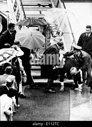 President Gerald Ford falling down the airplane stairs Stock Photo