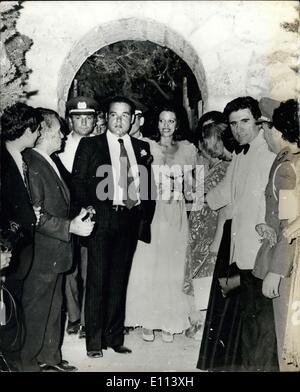 Jul. 24, 1975 - Christina Onassis marries Alexander Andreadis in Athens Subure: Christina Onassis, 25, who inherited her shipping magnate father's financial empire last March, was married earlier this week to Alexander Andreadis, 30, son of banker industrialist, Prof. Stradis Andreadis the simple Greek Orthodox ceremony was held in a private chapel in the exclusive seaside Athens suburb of Glyfada. Photo shows Christina and her husband Alexander seen after their wedding with some of the guests. Stock Photo
