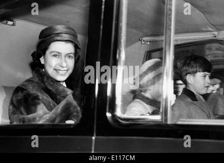 Queen Elizabeth II riding in car with children Stock Photo