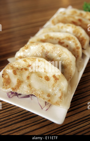 Gyoza Japanese steamed dumplings also known as Potsticker or  Jiaozi Stock Photo