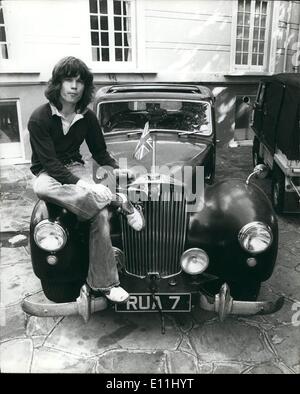 Apr. 04, 1978 - With the Union Jack flying high, Chris Jagger sits on the bonnett o his car outside his temporary London home. Stock Photo