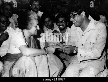 INDIRA GANDHI, Prime Minister of India is given a check by a Congress worker for flood relief Stock Photo