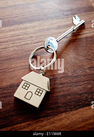House keys on a dark wooden table top - new home door key - house key - front door key Stock Photo