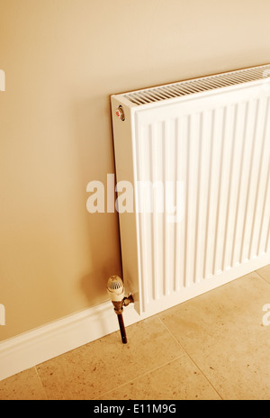 Standard Radiator mounted on a wall of a home. Stock Photo