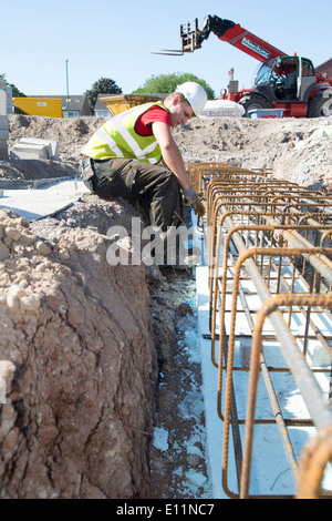 builder laying foundations  on site on a new house build nottingham Stock Photo