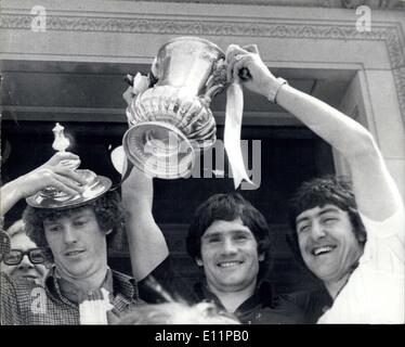 May 14, 1979 - Tremendoue Reception For Arsenal - The Cup Winners - A Crowd of Some 200,000 packed the Streets of North London Yesterday, when they gave a welcome home to the Arcenal players, after their victory over Manchester United in Saturday's FA Cup Final. The Players were driven from the Club's Highbury Stadium to Ielington Town Hall for a Civic Reception - Keystone Photo Shows:- Arsenal Players show off the FA Cup from the balcony of Islington Town Hall Yesterday. They are Graham Rix; Pat Rice and Bria Taibot Stock Photo