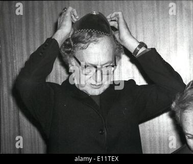 Mar. 03, 1980 - Archbishop of Canterbury Robert Runcie attends luncheon of British Jews: Today the Archbishop of Canterbury, Robert Runcie, attended a luncheon given by the Board of Deputies of British Jews at Woburn House, London. Photo shows Archbishop Runcie puts on a copel before sitting down to lunch. Stock Photo