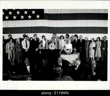 Apr. 11, 1980 - Carter Concedes Election For Presidency Washington, D.C.: President Jimmy Carter (at Podium), surrounded by member of his family and his cabinet members (background), concedes defeat to Ronald Reagan before campaign workers here in Washington last night. Regan won the election in a landslide and the Republicans made big gains in the U.S. Senate and House of Representatives with possible control of the senate.. With some states till up in the air or too close to call, Reagan is leading with more than 450 Electorial votes. Stock Photo