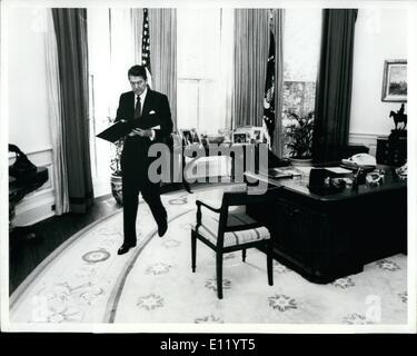 President Reagan working at his Oval Office desk shortly before ...