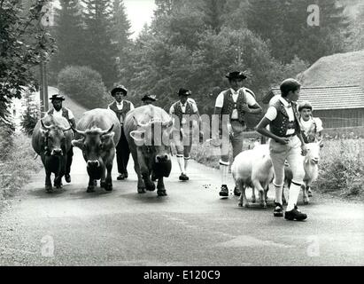 Aug. 08, 1981 - Returning from the alps: Lovely scene in beautiful Switzerland: Alpine herdsmen in their traditional costumes return with their animals from the high up situated Alps where they stayed during summer time. Picture was taken in Eastern Switzerland (in a region called Toggenburg) these days. Stock Photo