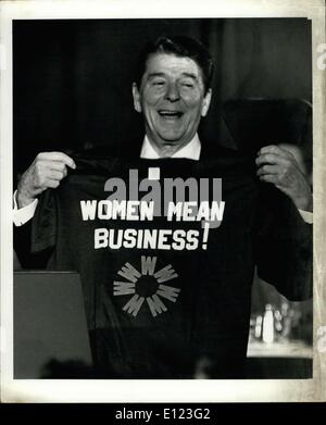 Apr. 05, 1984 - April 5th 1984, The Grand Hyatt Hotel, New York City. President Ronald Reagan addressed the 5th Women in business and Women's business ownership conference held at the grand Hyatt hotel in New York City today. President Reagan was the Luncheon speaker. OPS holding up a tee shirt the conference gave him as a preseant. Stock Photo