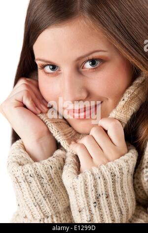 Oct. 29, 2009 - Oct. 29, 2009 - Portrait of beautiful young woman wearing turtleneck on white background Stock Photo