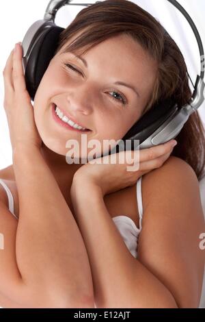 Aug. 10, 2009 - Aug. 10, 2009 - Young woman with headphones listening to music Stock Photo