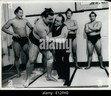 Dec. 26, 2011 - Too Tough for Little Caesar Ã¢â‚¬Â¦ Tough guy of the screen - Edward G. Robinson. famous for his gang leader parts. is now in Tokyo to co-star with Shirley MacLaine, Yves Motand and Bob Cummings in Steve Parker's My Geisha . for Paramount. recently invaded the Sumo wrestling room at Asakusa Kokugikan, Tokyo, scowled. but awed nobodyÃ¢â‚¬Â¦ The wrestler he is attacking is Tadao. who weighs 330 lbs, stands six feet one, and who is not trying very hard. looks quite amusedÃ¢â‚¬Â¦ Other Sumo wrestlers look onÃ Stock Photo