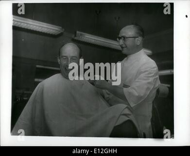 Dec. 26, 2011 - Adlai Stevenson during 1952 election campaign taking haircut between two Europe events at R R station. I Stock Photo