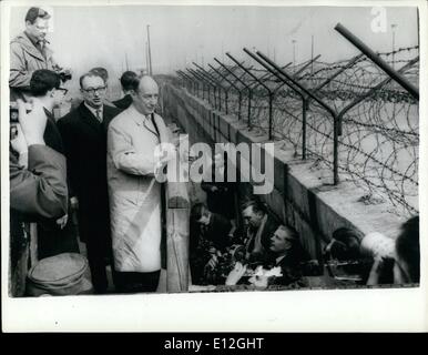 Dec. 26, 2011 - Adlai Stevenson In Berlin: Mr. Adlai Stevenson, the Chief U.S. delegate to the United Nations is on a visit to West Berlin. Photo Shows Mr. Adlai Stevenson looks over the Berlin Wall in the Potsdam Place today. Stock Photo