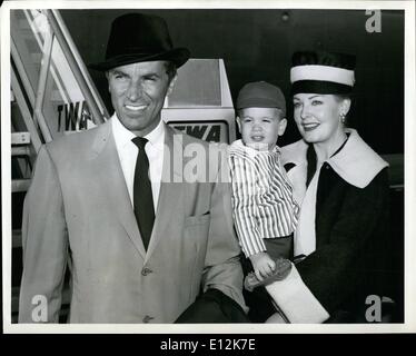 Feb. 24, 2012 - N.Y. International Airport, Sept. 27. The handsome family of Fernando Lamas (She's screen star Arlene Dahl) including their son, Lorenzo, 19 months, add a glamorous touch to the airport scene following their arrival via TWA's Jetliner from Los Angeles. The Lamases, who make their home in New York City, returned from Hollywood where they worked on their respective movie. She just completed Journey to the Center of the Earth and he acted in and directed Once More with FeelingÃ Stock Photo