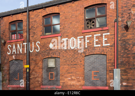 'Santus Toffee' makers of  'Uncle Joe's Mint Balls', set in brickwork on the Santus Sweets factory on Dorning Street, Wigan. Stock Photo