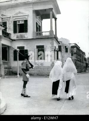 Feb. 25, 2012 - An Angolian soldier on guard in Maceo passed by two nuns. Stock Photo