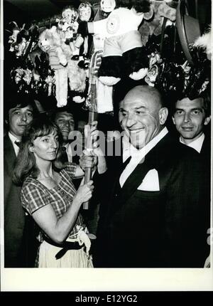 Feb. 26, 2012 - ''Kojak'' Telly Savalas in Munich West Germany one of the most Famous Hollywood stars in this time: Telly Savalas (Telly Savalas). came to Munich West Germany and, of Course, he took the opportunity to visit the current ''Oktoberfest''. ''Mr.Kojak'', by this main part in the well known TV Serial he got popularity in west Germany. stayed in Munich and other German towns because pf a publicity Campaign for a washing power product. Photo Shows Savalas with a Souvenir -Seller -girl at the Munich ''Oktoberfest' Stock Photo