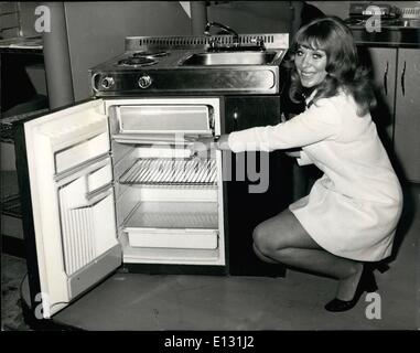 Feb. 26, 2012 - International Hotel & Catering Exhibition - Hotelympia 1972.: The International Hotel & Catering Exhibition - Hotelympia 1972 - opened today at Olympia, London. Photo shows Maggie Neale pictured on the W.C. Wood Company Ltd. stand - with a complete housekeeping unit, co prising refrigerator, stove and sink - all just 30'' wide. Stock Photo