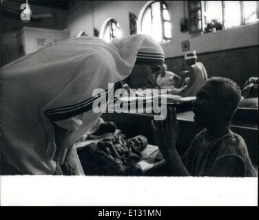 Feb. 26, 2012 - Mother Teresa listens intently to the prayer of a dying victim of poverty.  US Stock Photo