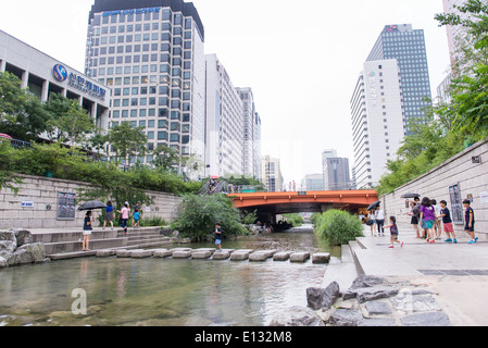 Cheonggyecheon stream in Seoul, South Korea with kids playing in the water Stock Photo