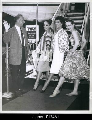 Feb. 28, 2012 - Famous Choregrapher Jerome Robbins sets three of his dancers through an impromptu ballet routine prior to winging their way, with 23 other members of the troupe, via TWA's Jetstream to Rome on the first leg of a four-month tour of Europe billed as ''Ballets:U.S.A.''. The three girls are (L to R): Jamie Bauer, Gwenn Lewis and Wilma Curley the tour is under the auspices of Leland Hayward in Association with the international cultural program of the United States, administered by the American National theatre and Adademy. Stock Photo