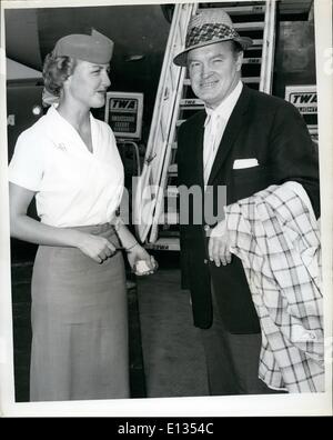 Feb. 26, 2012 - N.Y. International Airport, July 29 - Popular Comedian, Bob Hope Is Greeted By TWA Hostess Lucille Linciewicz Before Boarding A TWA Jetliner To Los Angeles, Where He Will Be On Hand To Celebrate His Daughter's Birthday. Hope Has Been In Town For 3 Days Following His 3 Week Visit In Europe Where He Helped Publicize His Movie ''Alias Jesse James' Stock Photo