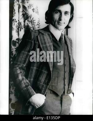 Feb. 28, 2012 - Nasty - The Model: Ilie Nastase, The Rumanian tennis star who is noted for showing off on the tennis court, is seen here showing off the fashions of the famous French tailor Guy Laroche, for the fourthcoming Autumn/Winter. Ilie is seen here wearing a three-place flannel suit, the jacket Scottish style in yellow, green and orange design on plain grey, with the hand-sewn trousers and waistcoat in becoming pastel grey. Stock Photo