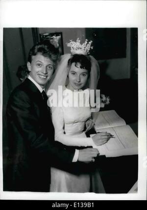 Feb. 29, 2012 - Tommy Steele weds in Soho. Signing the register: Huge crowds attended the wedding this afternoon at St. Patrick's Church, Soho of 'rock' singer Tommy Steele to Miss Ann Donoghue. Photo shows The Bride and bridegroom signing the register after their wedding this afternoon. Stock Photo