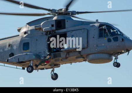 Royal Navy Merlin helicopter lowers a winchaman at 2013 Southport airshow Stock Photo