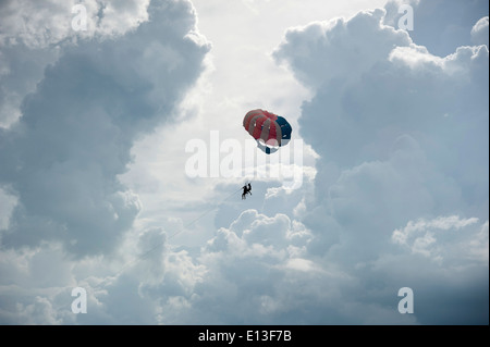 Paragliding in monsoon rain & storm clouds on Batu Feringgi Beach ...