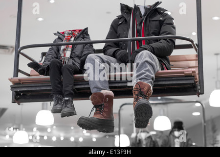 Mannequins wearing boots and jackets in a store Stock Photo