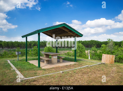 Picnic area with table and grill in a park Stock Photo