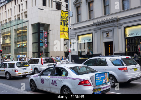 Sydney Australia,New South Wales,CBD Central Business,District,George Street,taxi,cab,traffic,Louis Vuitton,shopping shopper shoppers shop shops marke Stock Photo