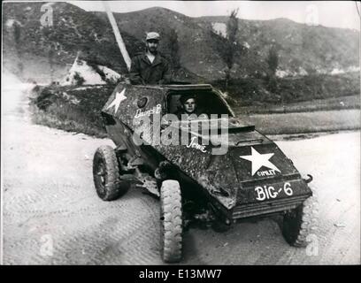 Mar. 22, 2012 - Russian made armoured car captured by United Nations forces in Korea: CPL. Harvey stoner of Plainville, Kansas 6132nd. Tactical Control Group (driving) and CPL, Wilner Dungelman of Bridgeport, Comn. 21st. Infantry Regiment, 24th. Infantry Division (standing) -ride in a captured Russian made BA64, light armoured car, in Korea. Stock Photo