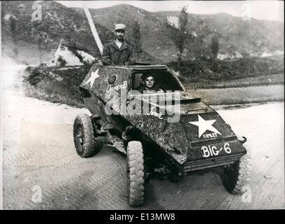 Mar. 22, 2012 - Russian made armoured car captured by United Nations forces in Korea: CPL. Harvey Stoner of Plainville, Kansas 6132nd. Tactical Control Group (driving) and CPL, Wilmer Dungelman of Bridgeport, Comn. 21st. Infantry Regiment, 24th. Infantry Division (standing) -ride in a captured Russian made BA64, light armoured car, in Korea. Stock Photo