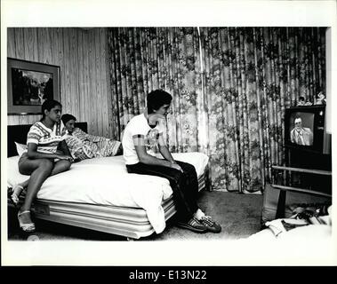 Mar. 02, 2012 - An 18 year old Cuban refugee, his wife, and her mother sit in a hotel room in Miami as they watch a Spanish news broadcast. The group was housed in the hotel by a private Cuban relief organization while a search for a sponsor was made. Stock Photo