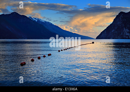 Riva del Garda town and Garda lake by night, Italy Stock Photo