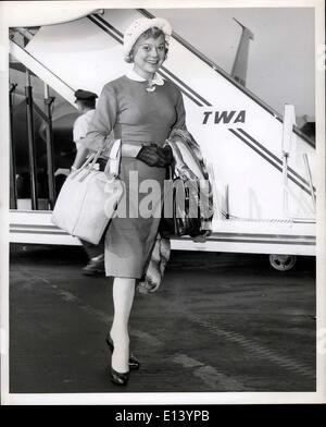 Mar. 31, 2012 - Idlewild Airport, N.Y., Sonia Henie, whose name remains synonymous with ice skating, looks as trim as ever on arrival here today via TWA's Jetliner from Los Angeles. She will leave later in the day for a European Holiday. Stock Photo
