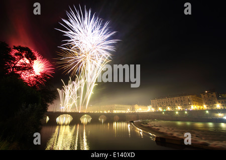 Fireworks show over river Po in Torino during Saint John's celebrations. On the left bridge Vittorio Emanuele I. Stock Photo