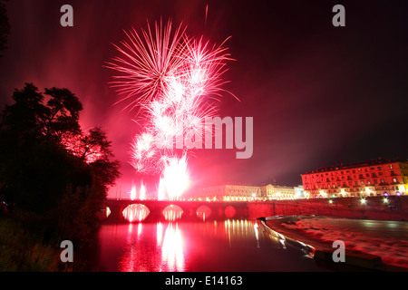 Fireworks show lightens the river Po in Torino during Saint John's celebrations. On the left bridge Vittorio Emanuele I. Stock Photo