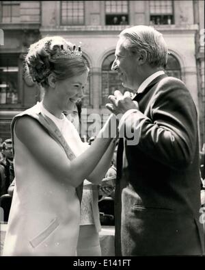 Mar. 31, 2012 - Edward Heath opens Britain's thirteenth dairy festival outside the Royal Exchange: Mr. Edward Heath, Leader of the Opposition, today opened Britain's thirteenth Dairy Festival outside the Royal Exchanger in the City. The theme ''The Dairy Festival'' - Fun for the Family. Photo shows Mr. Edward Heath has a daisy pinned to his lapel by Christine Ginss, the reigning Dairy Queen of England and Wales, when he arrived for the opening ceremony. Stock Photo