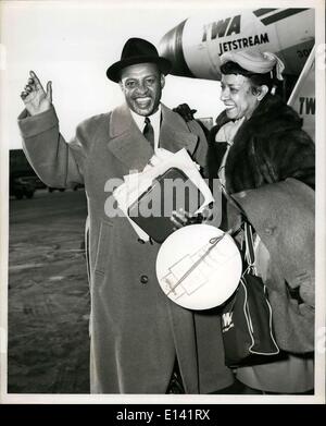 Mar. 31, 2012 - Idlewild Airport, N.Y., -- Lionel Hampton, jazz vibraharpist, and his wife Glady's are shown as they boarded TWA flight for London. Lionel is to appear at a Jazz Concert, in Festival Hall, London, and return home immediately. Stock Photo