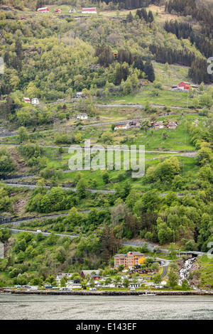 Norway, Geiranger, Geiranger fjord. Unesco World Heritage site. View on village and the Eagle Road's with 11 hairpin bends. Stock Photo